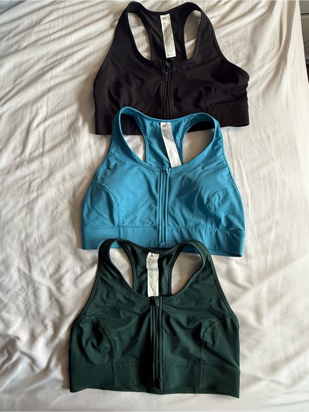 Fabletics 3-Pack Front-Zip Sports Bras — Black, Blue, Forest Green